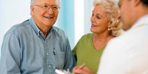 older couple talking to doctor
